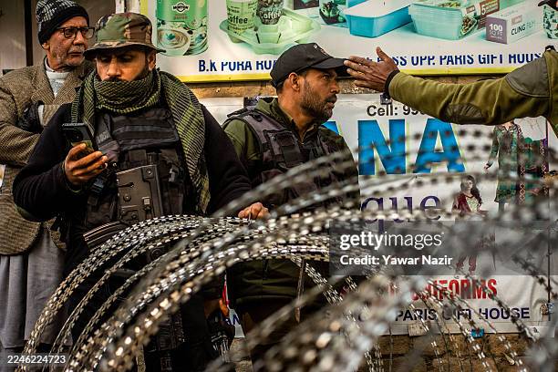 Indian policemen stand on patrol outside the Nowgam police station on November 15, 2025 in Kashmir, India.At least nine people were killed and dozens...