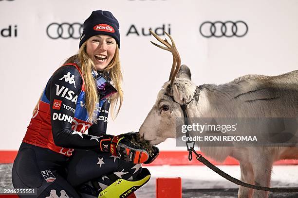 Winner USA's Mikaela Shiffrin poses with a reindeer after the second run of the women's slalom event of the FIS Alpine Skiing World Cup at the Levi...