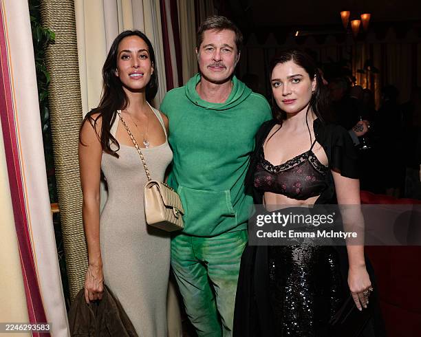 Ines de Ramon, Brad Pitt, and Eve Hewson attend Netflix's "Jay Kelly" Los Angeles premiere at Chateau Marmont on November 11, 2025 in Los Angeles,...