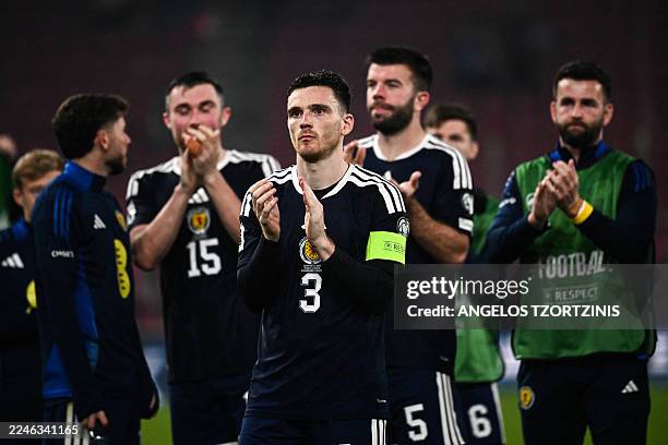 Scotland's defender and captain Andrew Robertson leads his teammates as they acknowledge the fans at the end of the FIFA World Cup 2026 Group C...