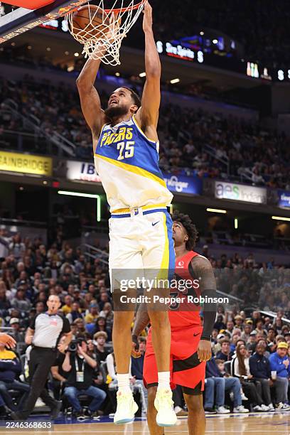 Jeremiah Robinson-Earl of the Indiana Pacers dunks the ball during the game against the Toronto Raptors on November 15, 2025 at Gainbridge Fieldhouse...