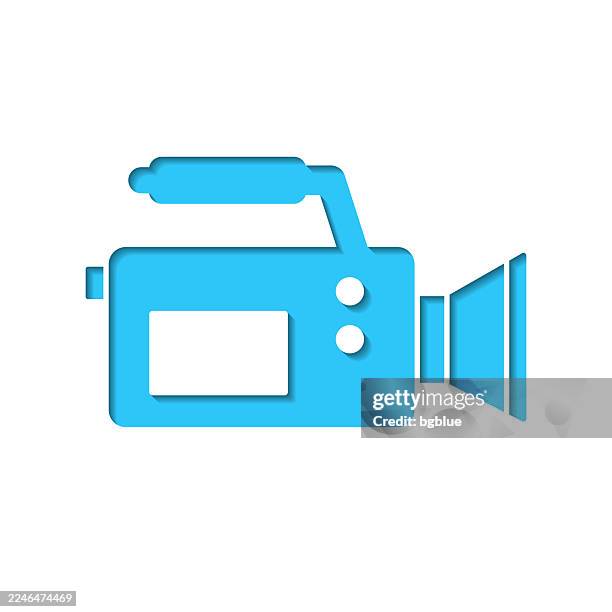 video camera. icon cut out on white paper with blue background - digital camcorder stock illustrations