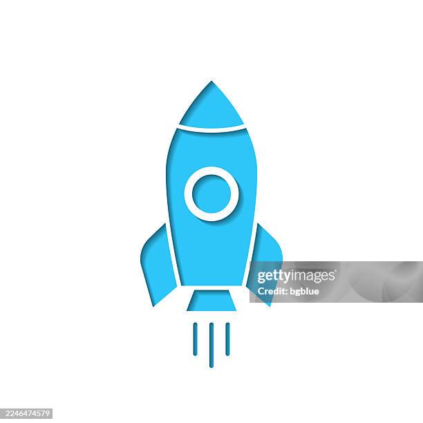 rocket. icon cut out on white paper with blue background - missile launch stock illustrations