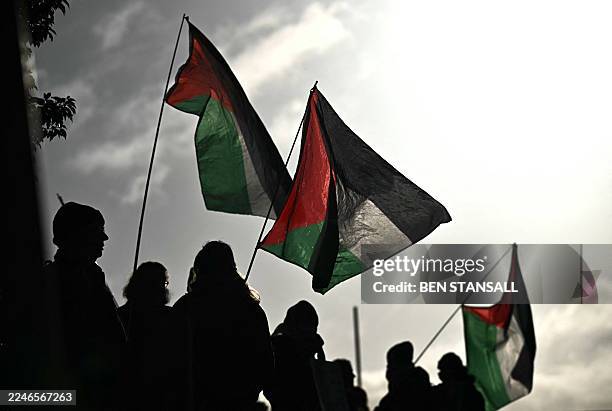 Supporters of alleged Palestine Action activists accused of breaking into Israeli-based defence firm Elbit Systems' site in Bristol in August 2024,...