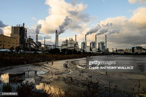 General view shows exhaust gases billowing from the chimneys of the Taean Thermal Power Station, a large coal-fired power station owned by Korean...