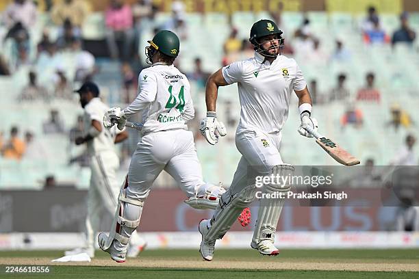 Ryan Rickelton and Aiden Markram of South Africa run between the wickets during the First Test match in the series between India and South Africa at...