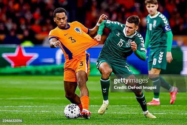 Amsterdam, Netherlands Jurrien Timber of the Netherlands and Gvidas Gineitis of Lithuania battle for the ball during the FIFA World Cup 2026...