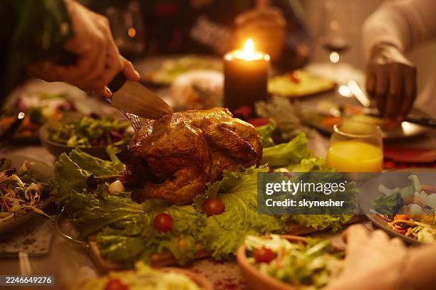 cutting roasted chicken! - new years day stock pictures, royalty-free photos & images
