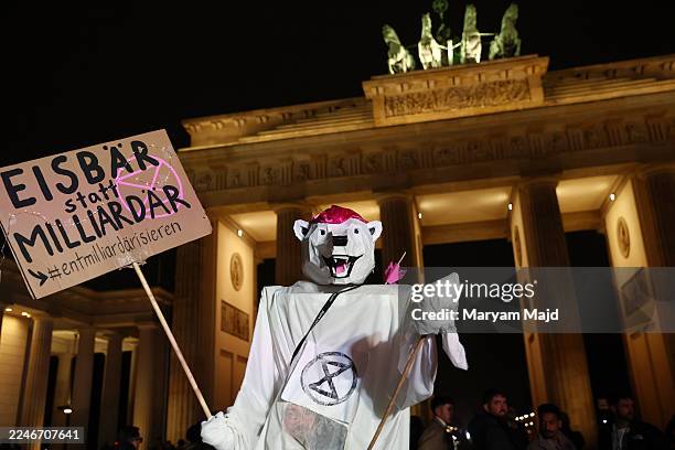 Climate activists of the Fridays for Future movement gather at the Brandenburg Gate to demand that Chancellor Friedrich Merz do more to ensure...