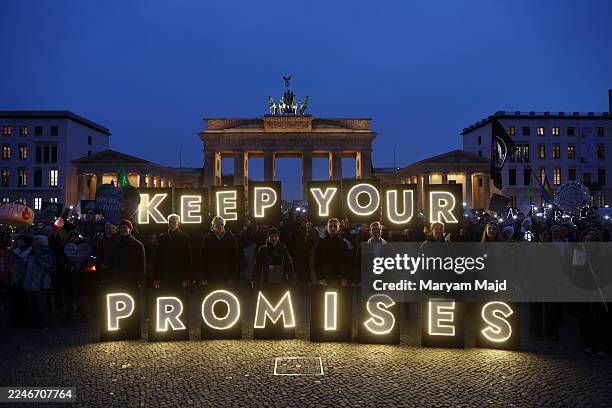 Climate activists of the Fridays for Future movement gather at the Brandenburg Gate to demand that Chancellor Friedrich Merz do more to ensure...