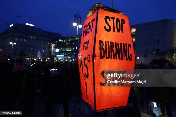 Climate activists of the Fridays for Future movement gather at the Brandenburg Gate to demand that Chancellor Friedrich Merz do more to ensure...