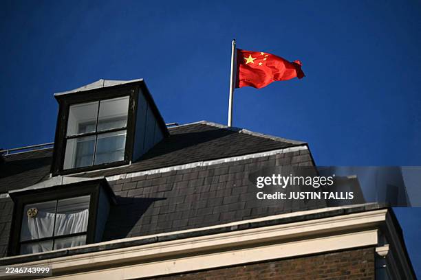 Flag flies atop a pole on the roof of the Embassy of the People's Republic of China in the United Kingdom, on Portland Place in London on November...