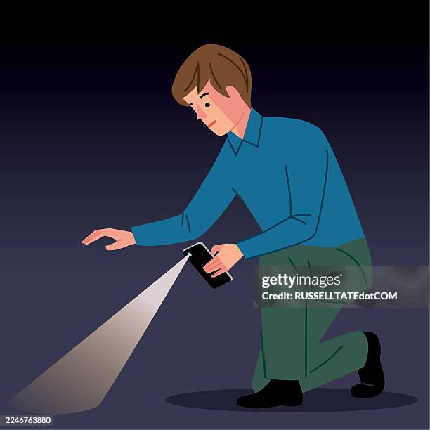 stockillustraties, clipart, cartoons en iconen met crouching man searching for something on the ground in the dark using the torch from his smartphone - schatzoeken