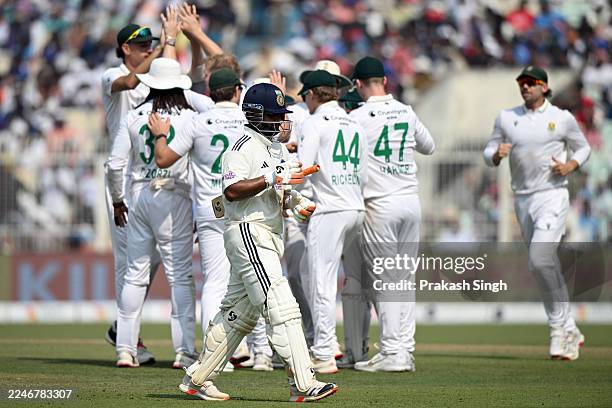 South Africa team celebrates as Rishabh Pant of India walks back to pavillion during the First Test match in the series between India and South...