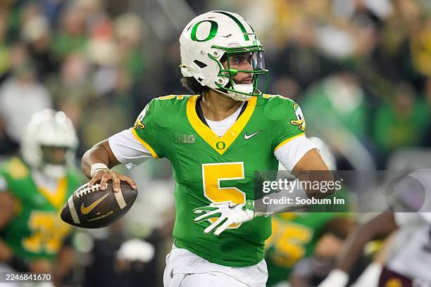 Dante Moore of the Oregon Ducks throws a pass during the first half against the Minnesota Golden Gophers at Autzen Stadium on November 14, 2025 in...