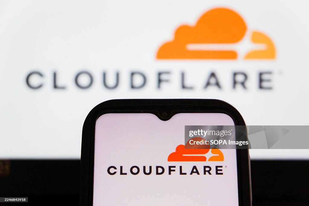 In this photo illustration, a Cloudflare logo is displayed...