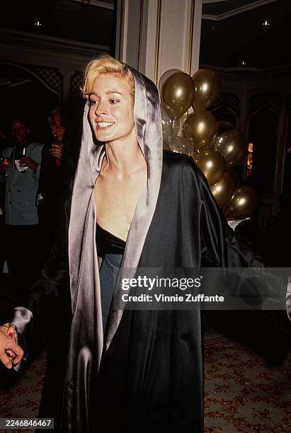 American actress Sean Young, wearing a black hooded coat with grey trim, attends an 'American Foundation for the Performing Arts' Gala at the Beverly...