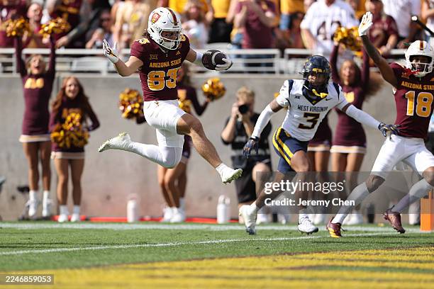 Derek Eusebio of the Arizona State Sun Devils scores a touchdown during the first half of the game against the West Virginia Mountaineers at Mountain...
