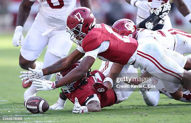 Lotzeir Brooks of the Alabama Crimson Tide recovers a fumble by Daniel Hill against the Oklahoma Sooners during the first quarter at Bryant-Denny...
