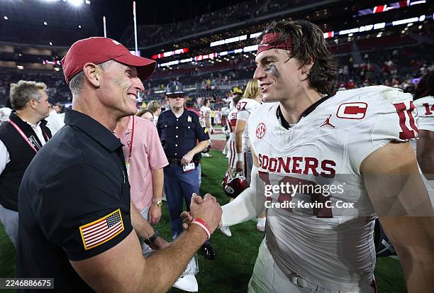 Head coach Brent Venables reacts with John Mateer of the Oklahoma Sooners after their 23-21 win over the Alabama Crimson Tide at Bryant-Denny Stadium...