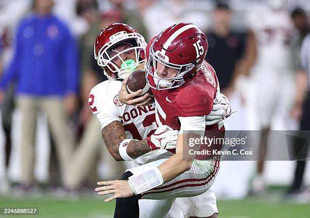 Devon Jordan of the Oklahoma Sooners sacks Ty Simpson of the Alabama Crimson Tide during the fourth quarter at Bryant-Denny Stadium on November 15,...