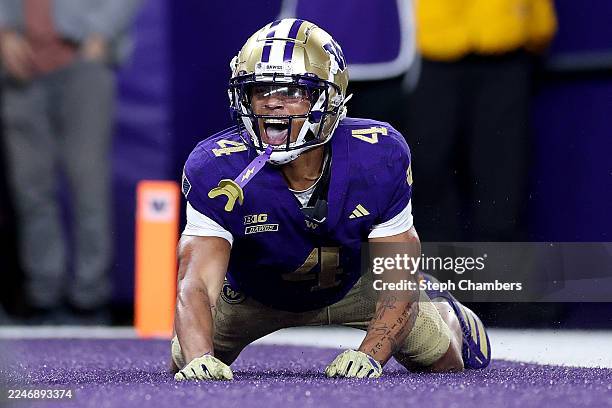 Jordan Washington of the Washington Huskies celebrates his touchdown against the Purdue Boilermakers at Husky Stadium on November 15, 2025 in...