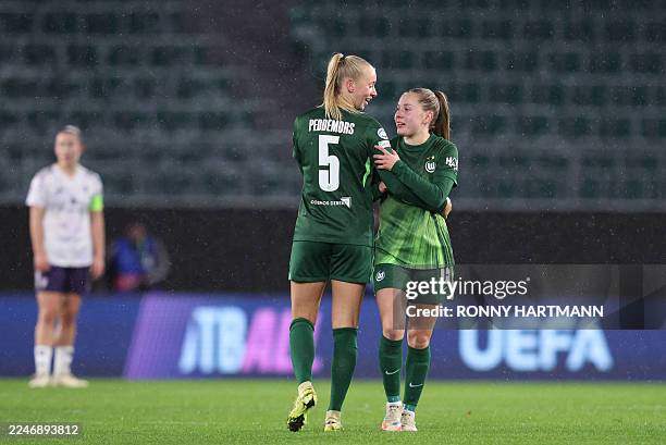 VfL Wolfsburg's Dutch midfielder Ella Peddemors celebrates with VfL Wolfsburg's Dutch defender Janou Levels after scoring the 2-1 goal during the...