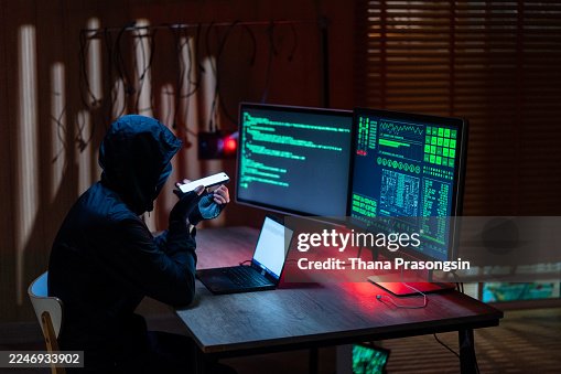Anonymous computer programmers coding or hacking into secure network database Anonymous computer programmers coding or hacking into secure network database