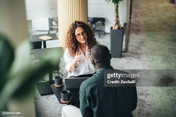 business partners on meeting - financial occupation stock pictures, royalty-free photos & images
