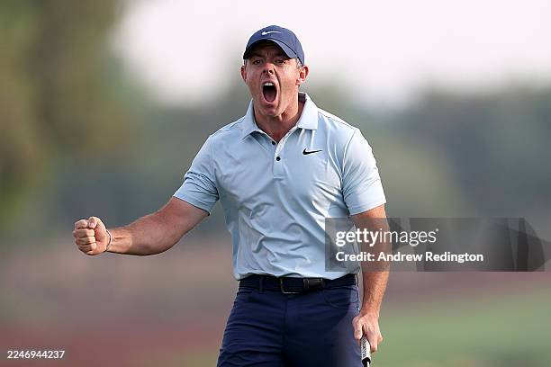 Rory McIlroy of Northern Ireland celebrates after putting on the eighteen green to force a playoff with Matt Fitzpatrick of England on day four of...