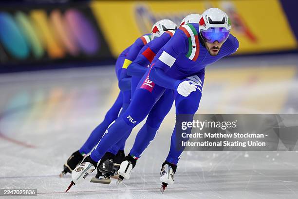 Davide Ghiotto , Michele Malfatti , and Andrea Giovannini of Italy compete in men's team pursuit during the ISU World Cup Speed Skating at Utah...