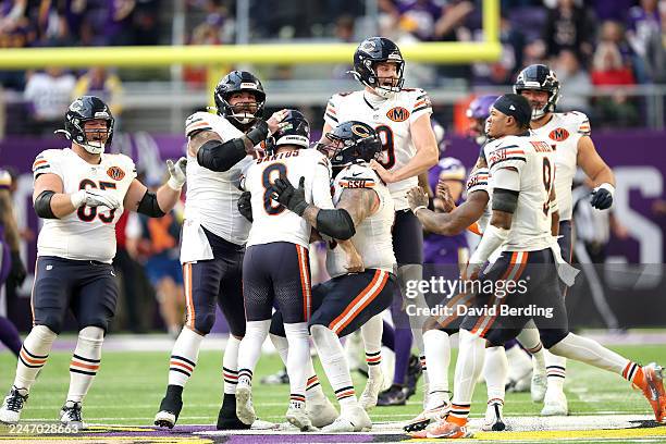 Cairo Santos of the Chicago Bears celebrates with the team after kicking the game-winning field goal to beat the Minnesota Vikings 19-17 at U.S. Bank...