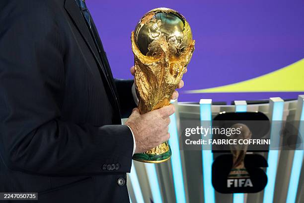 President Gianni Infantino holds the FIFA World Cup trophy following the 2026 FIFA World Cup European Play-Off draw at the FIFA's Home of Football in...
