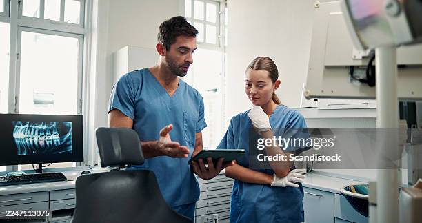 dentist, tablet and team in office for dental radiology, oral wellness or medical research. clinic, orthodontics and people with technology for telehealth, planning and review x ray with feedback - dentista imagens e fotografias de stock