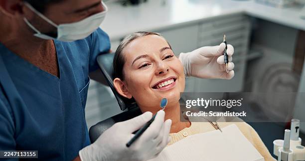 woman, happy and procedure in dentist chair with equipment, advice and results at hospital. people, orthodontist and patient with smile for teeth whitening tips, dental and oral wellness at clinic - tandarts stockfoto's en -beelden