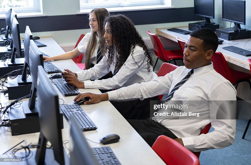 High school students working in a modern computer lab