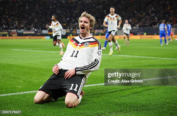Nick Woltemade of Germany celebrates scoring his team's first goal during the FIFA World Cup 2026 qualifier match between Germany and Slovakia at Red...
