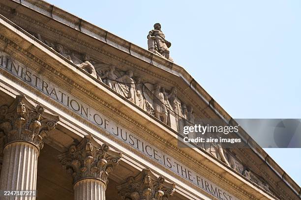 administration of justice building pediment with columns - lady justice stock pictures, royalty-free photos & images