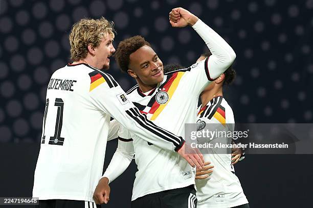Assan Ouedraogo of Germany celebrates scoring his team's sixth goal with teammate Nick Woltemade and Leroy Sane during the FIFA World Cup 2026...
