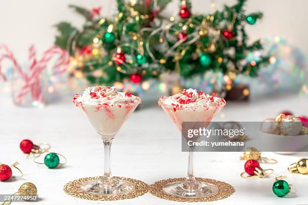 white chocolate peppermint martini with candy cane rim. - peppermint martini stock pictures, royalty-free photos & images