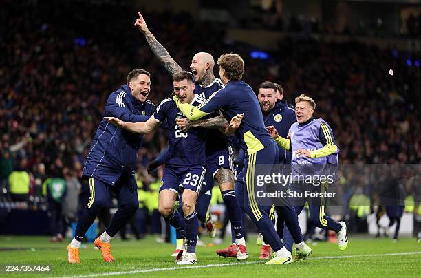 Kenny McLean of Scotland celebrates scoring his team's fourth goal with teammates during the FIFA World Cup 2026 qualifier match between Scotland and...
