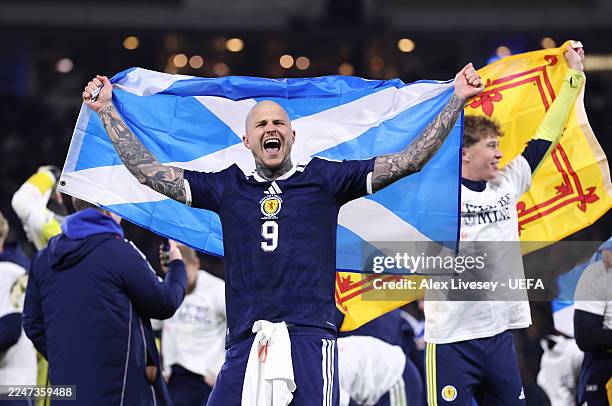 Lyndon Dykes of Scotland celebrates after the team's victory during the FIFA World Cup 2026 qualifier match between Scotland and Denmark at Hampden...