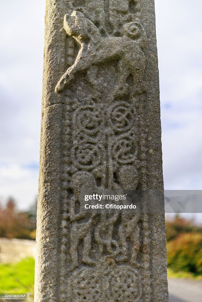 Animal and Human Figures on Ancient High Cross