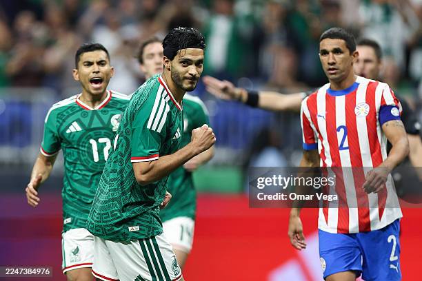 Raul Jimenez of Mexico celebrates after scoring a penalti during an international friendly match between Mexico and Paraguay at Alamodome on November...