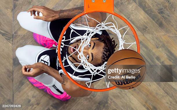Nic Claxton of the Brooklyn Nets looks to grab a rebound against the Boston Celtics during their game at Barclays Center on November 18, 2025 in New...
