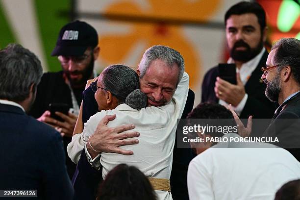 President Andre Correa do Lago hugs Brazil's Environment Minister Marina Silva after her speech at the COP30 UN Climate Change Conference in Belem,...