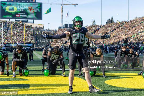 Bryce Boettcher of the Oregon Ducks cheers before their game against the Southern California Trojans at Autzen Stadium on November 22, 2025 in...