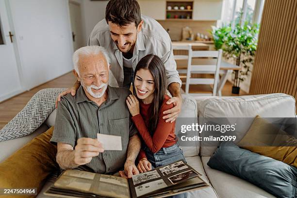 memories - looking at old photo stock pictures, royalty-free photos & images