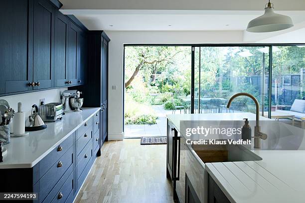 marble island with counter in modern kitchen - kitchen island stock pictures, royalty-free photos & images