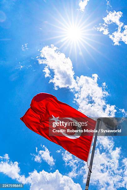 flag of turkey waving under sunlight - turkish flag stock pictures, royalty-free photos & images